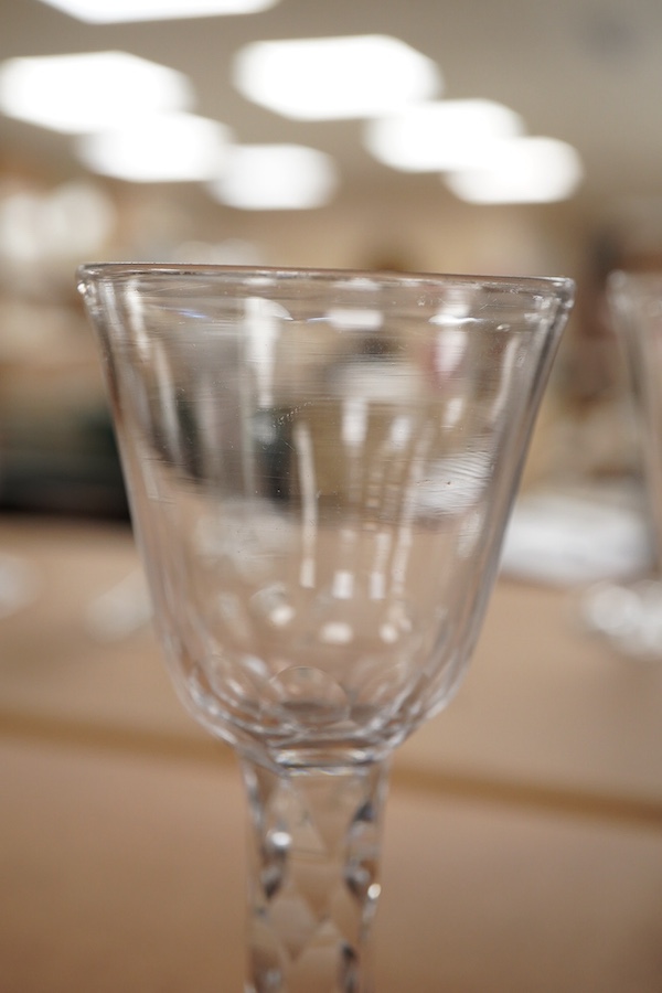 A pair of late 18th century wine glasses with faceted stems, 15cm high